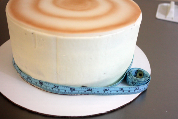 Birch Tree Winter Wedding Cake - measuring the circumference of the cake