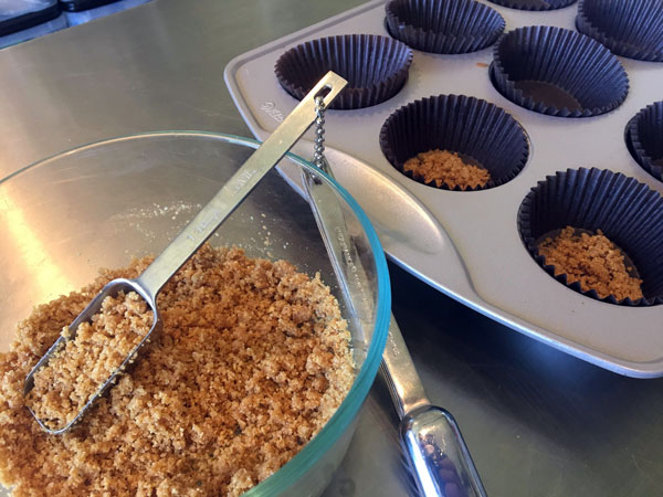 making the Graham cracker crust for the s'mores cupcakes